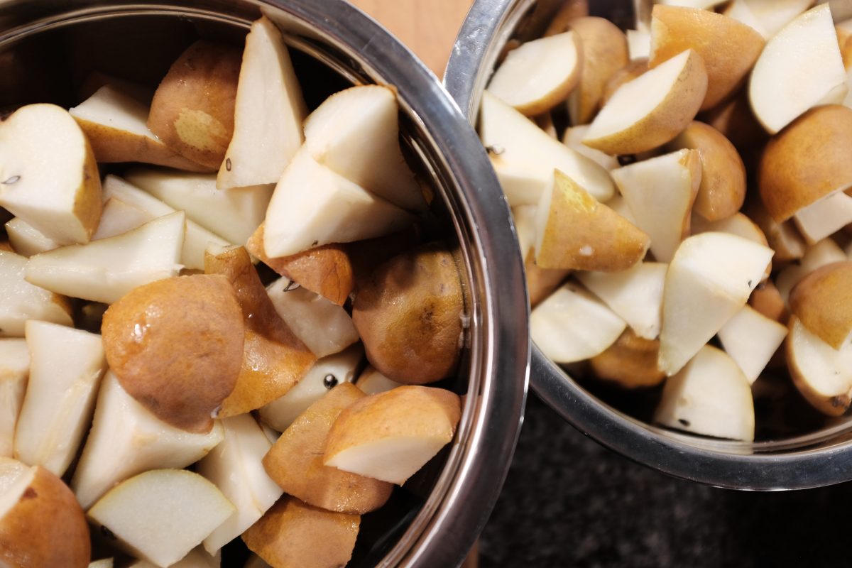pears in a bowl, chopped into large chunks