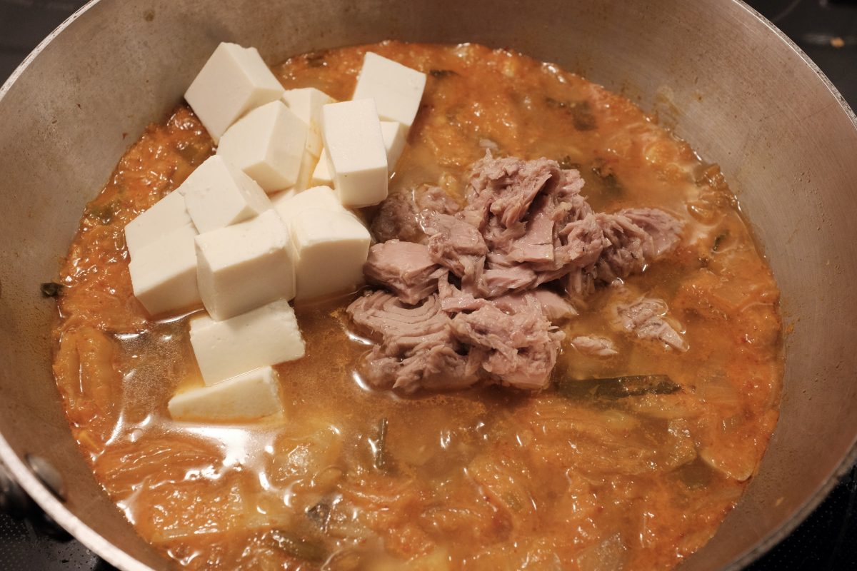 adding tofu and canned tuna