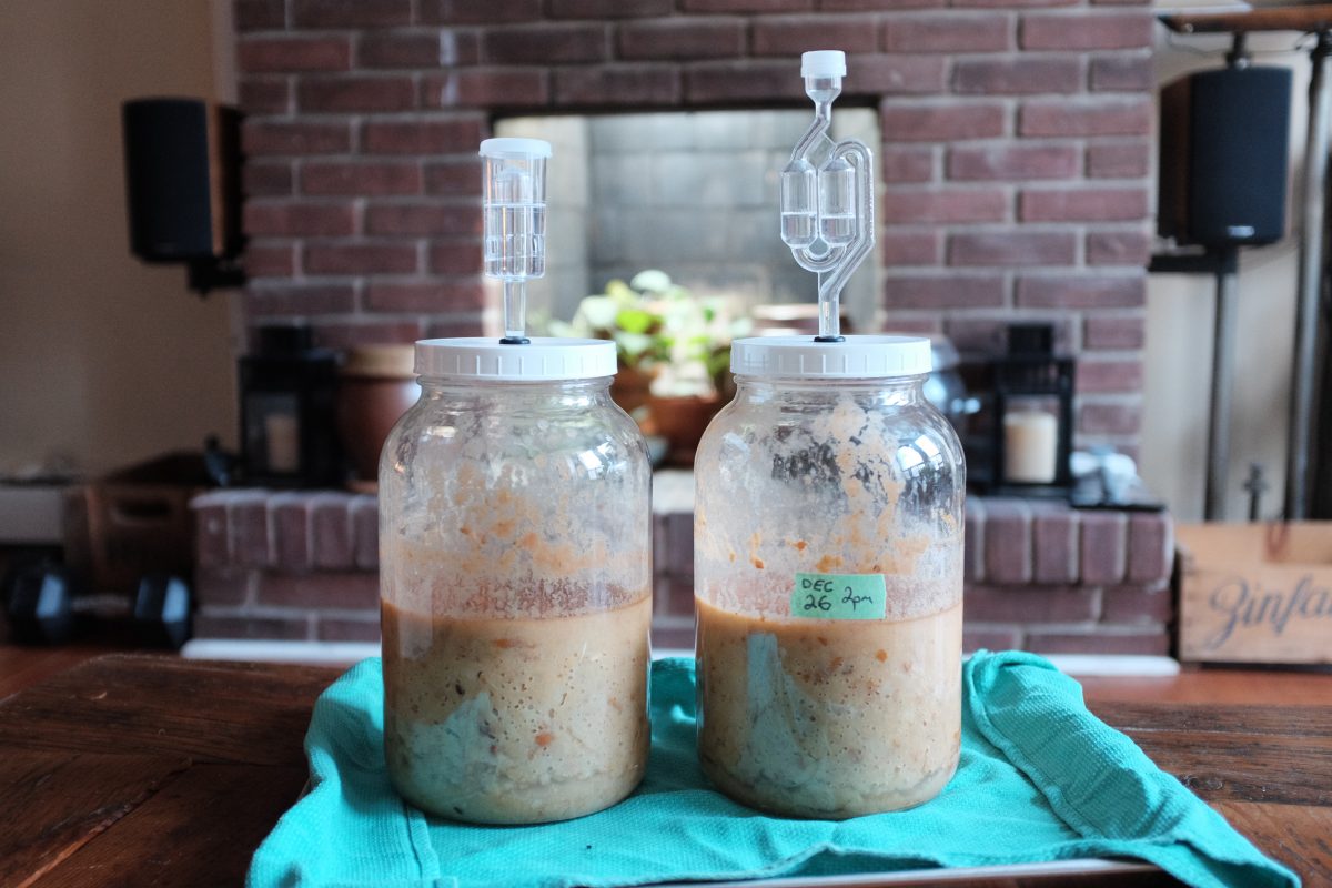 two jars of pear alcohol. First stage of pear vinegar is done