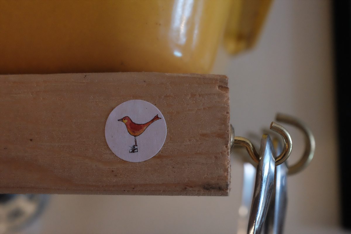 little bird sticker on shelf edge