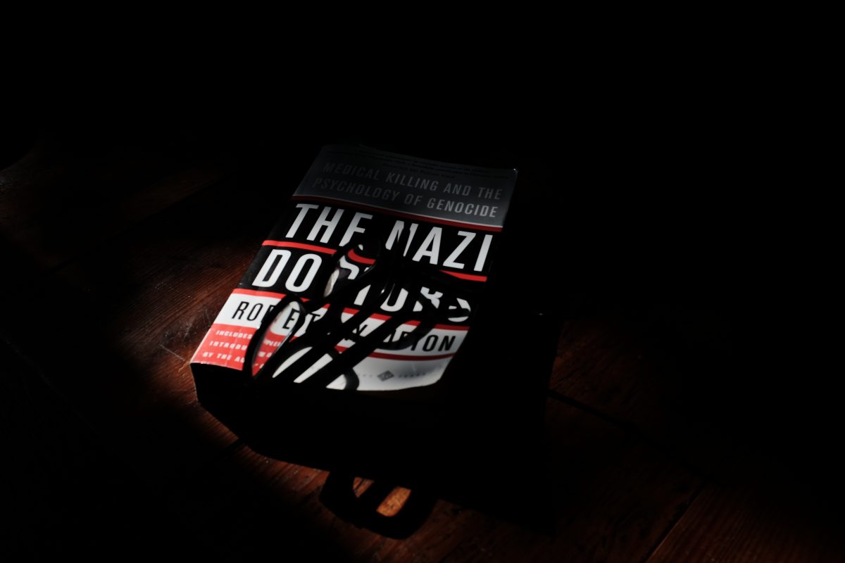 a book on a table spotlit by a sunbeam